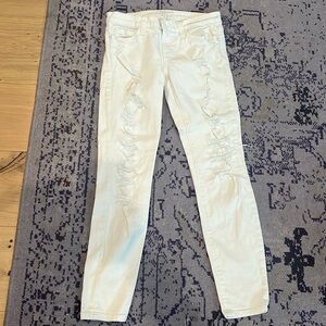 White holy jeans